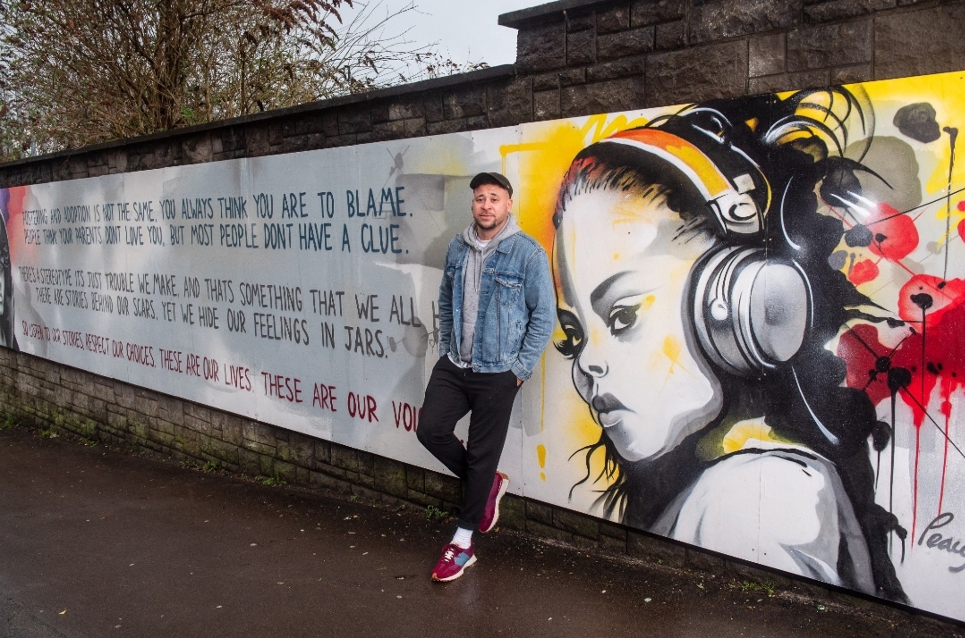 Former Children’s Laureate Wales, Connor Allen with the mural