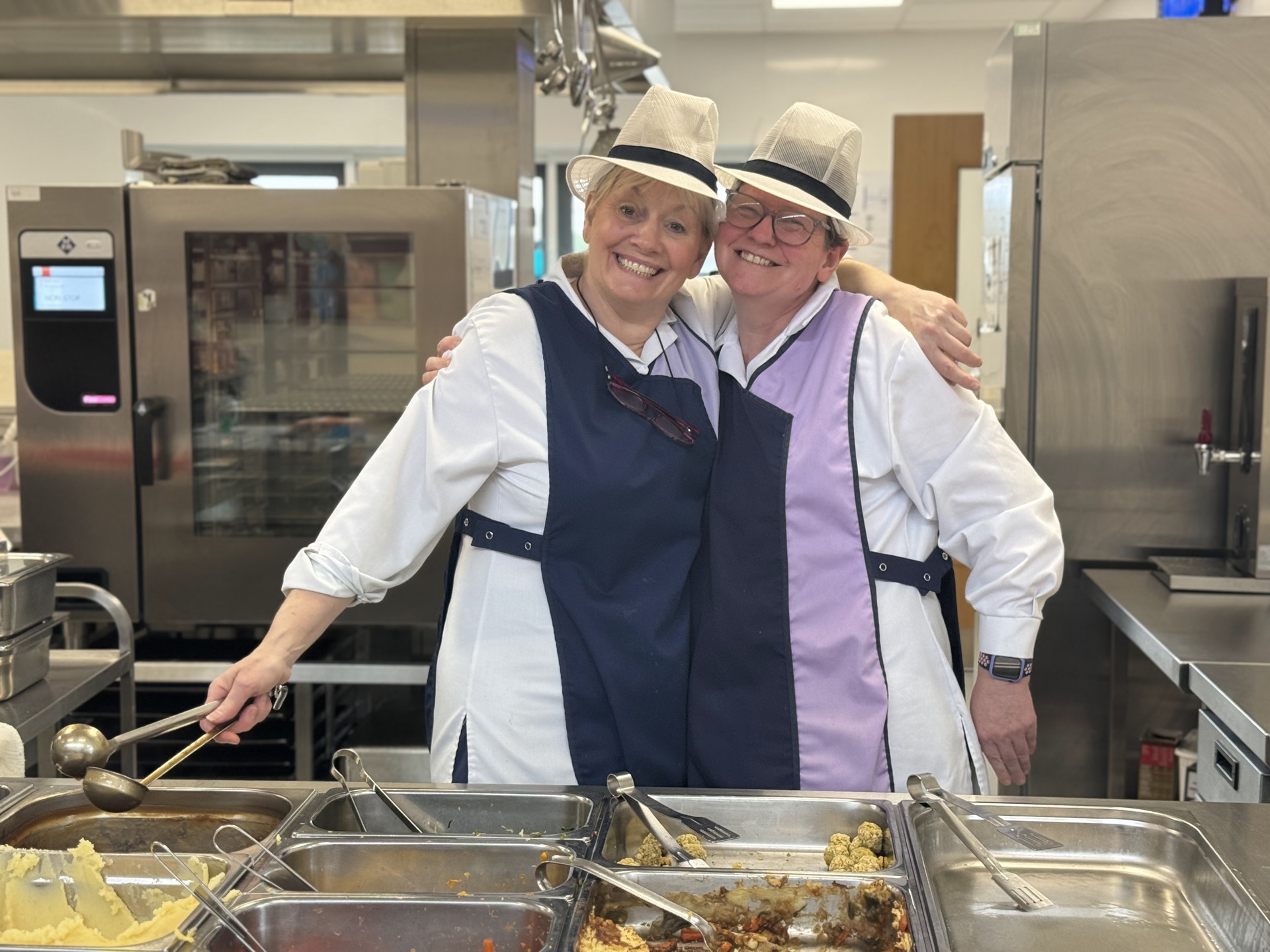 Catering staff in school kitchen