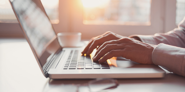 Person typing on laptop