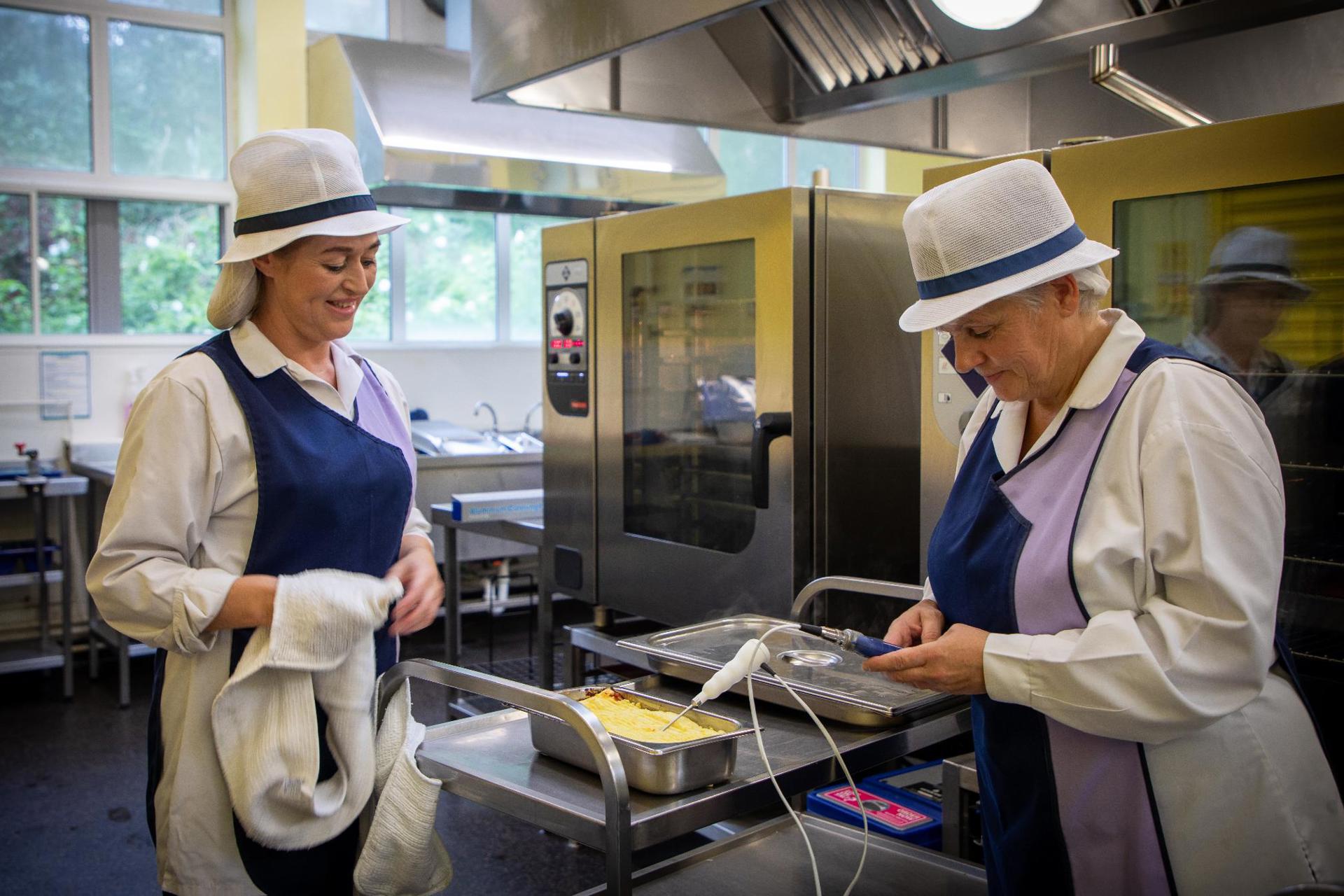 Catering staff in school kitchen