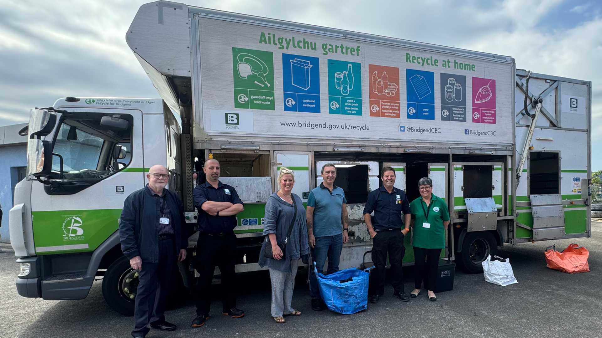 (Middle) Council Leader Cllr John Spanswick joined by (L-R) Local Councillors Richard Williams and Melanie Evans with representatives from Plan B Management Solutions and the council’s Recycling and Waste team