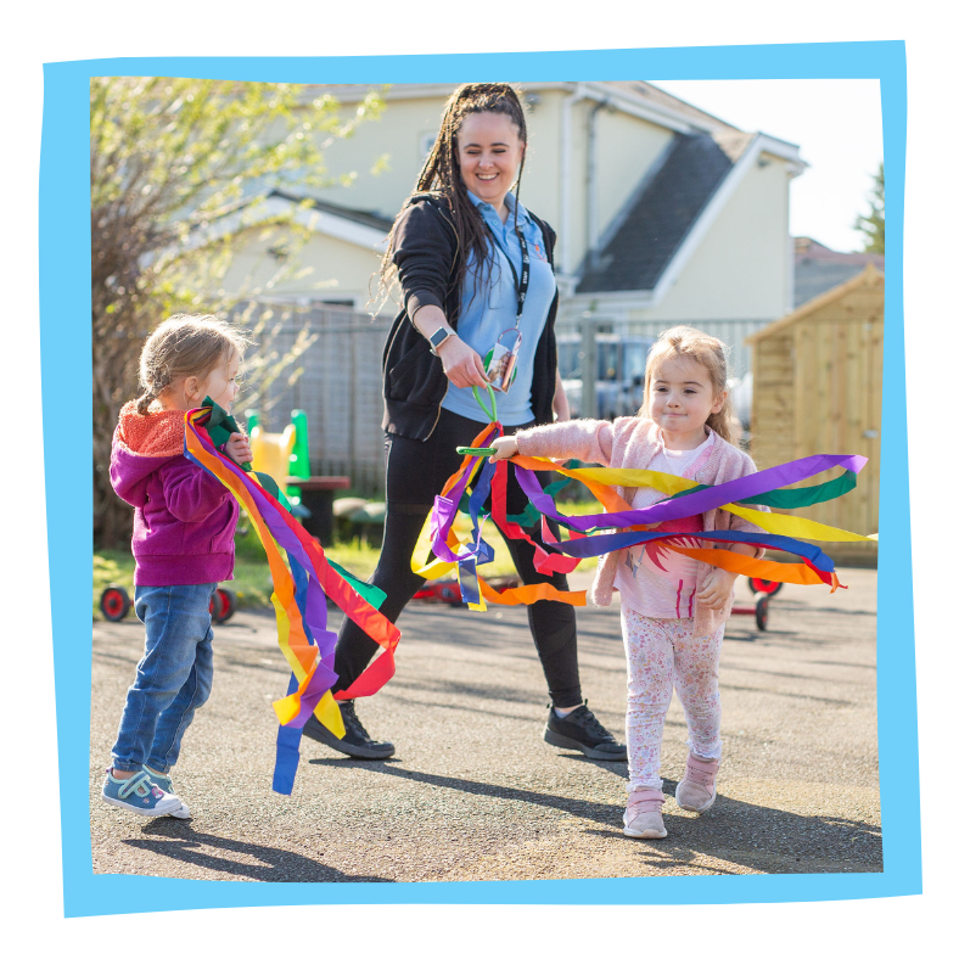 Children playing with ribbons