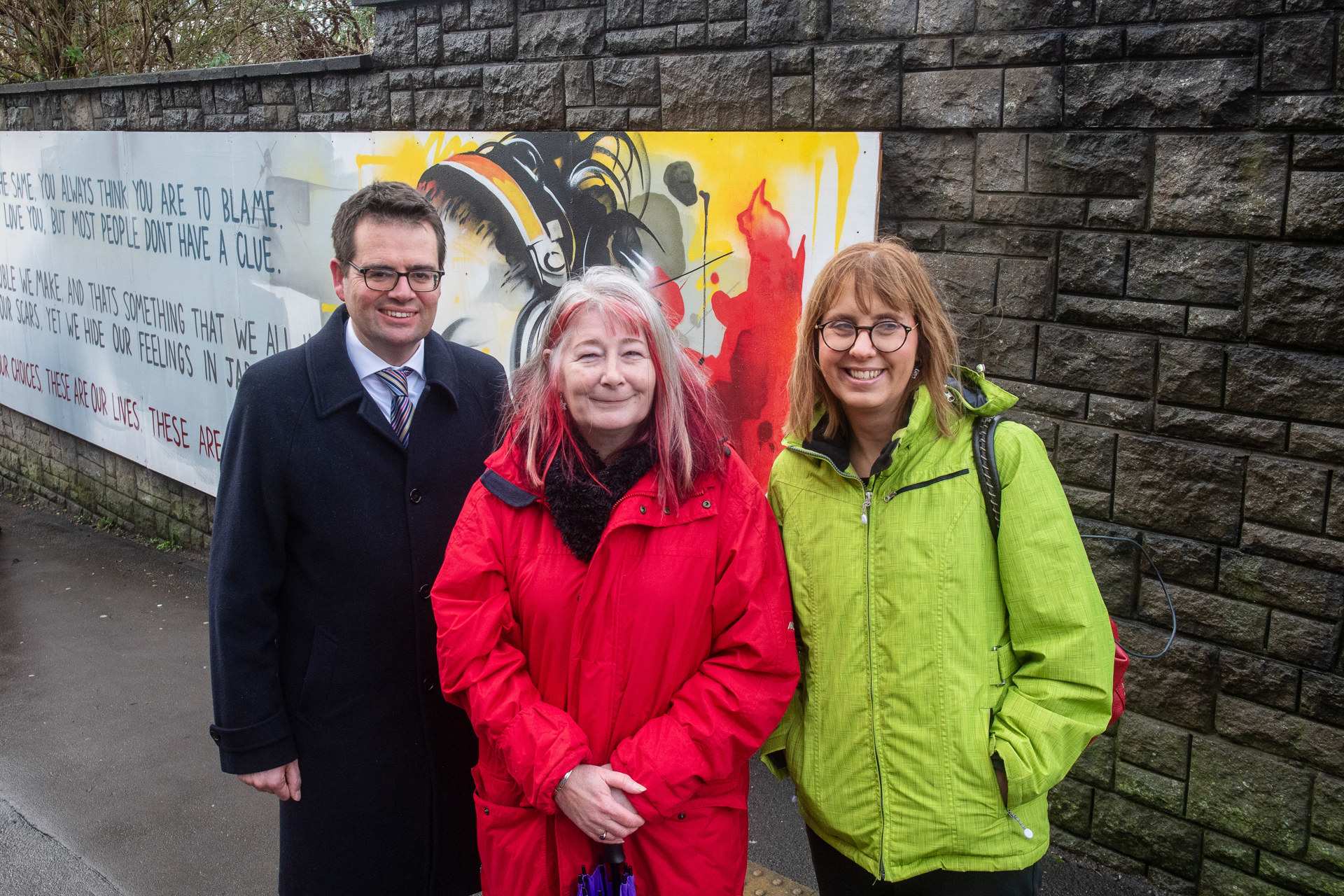 Foster Wales Bridgend team with partners and council’s Cabinet Members at the unveiling of the mural